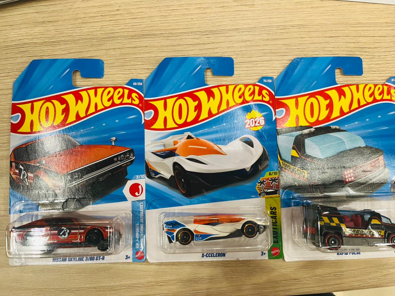 HOTWHEELS BASIC CAR ASSORTMENT 2026 D CASE NISSAN SKYLINE 2000 GTR + X CCELERON + RAPID PULSE